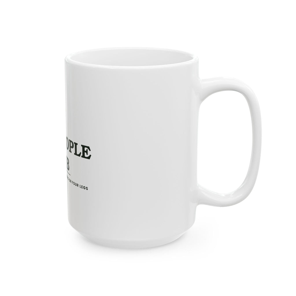Dog People Club mug on a wooden table in a warm kitchen