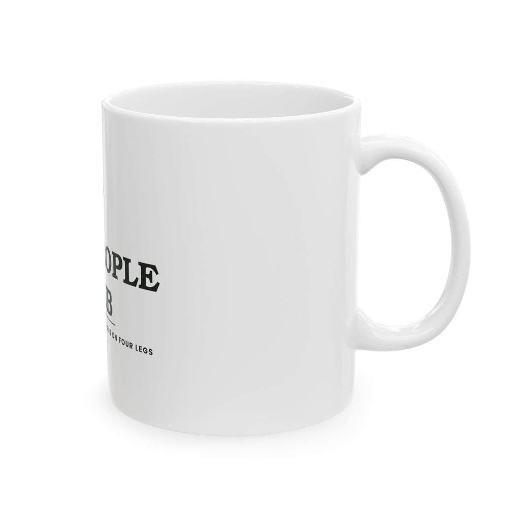Dog People Club mug filled with coffee, styled with candles and pine cones